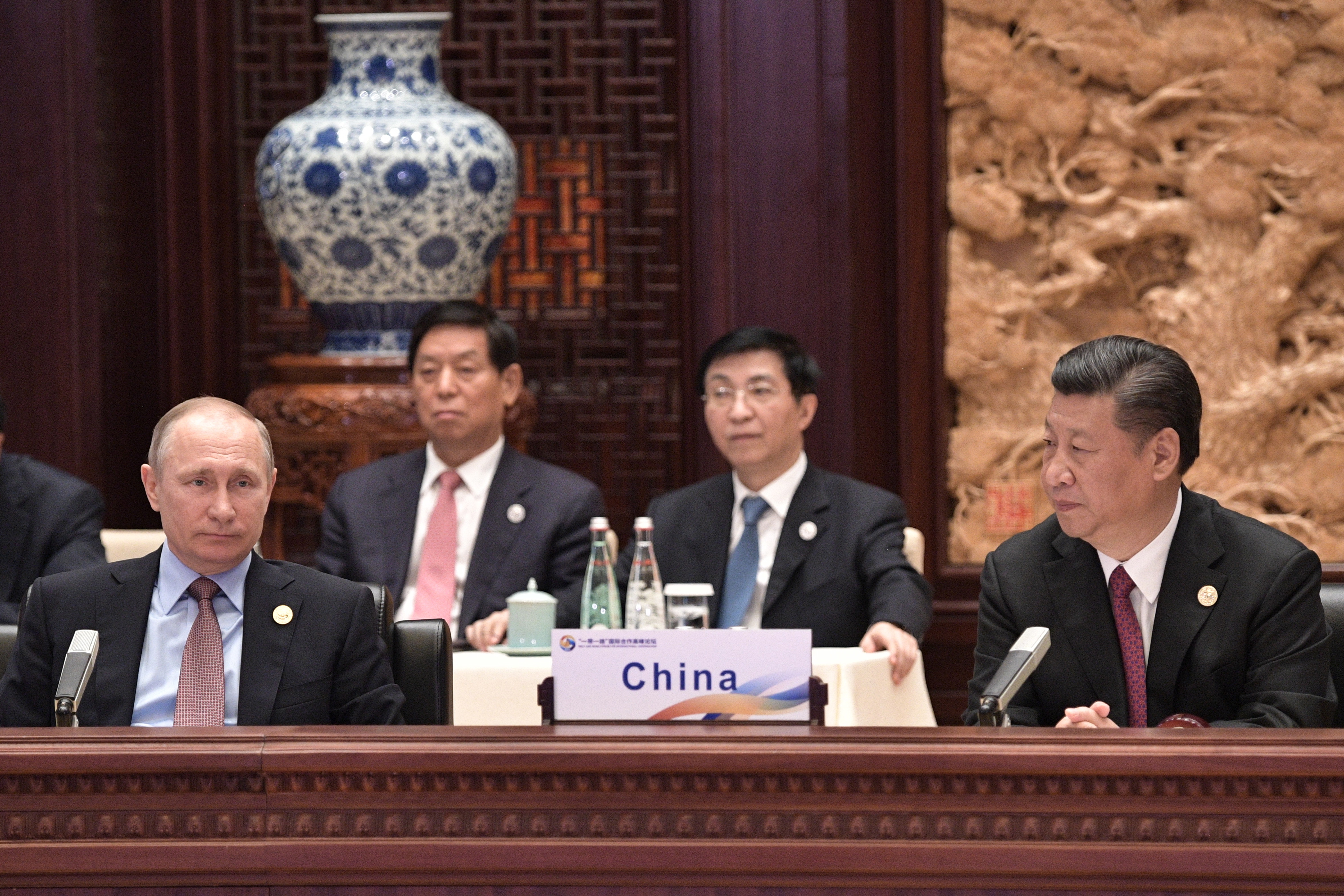 Russia’s President Vladimir Putin and China’s President Xi Jinping attend the first roundtable session at the One Belt, One Road international forum